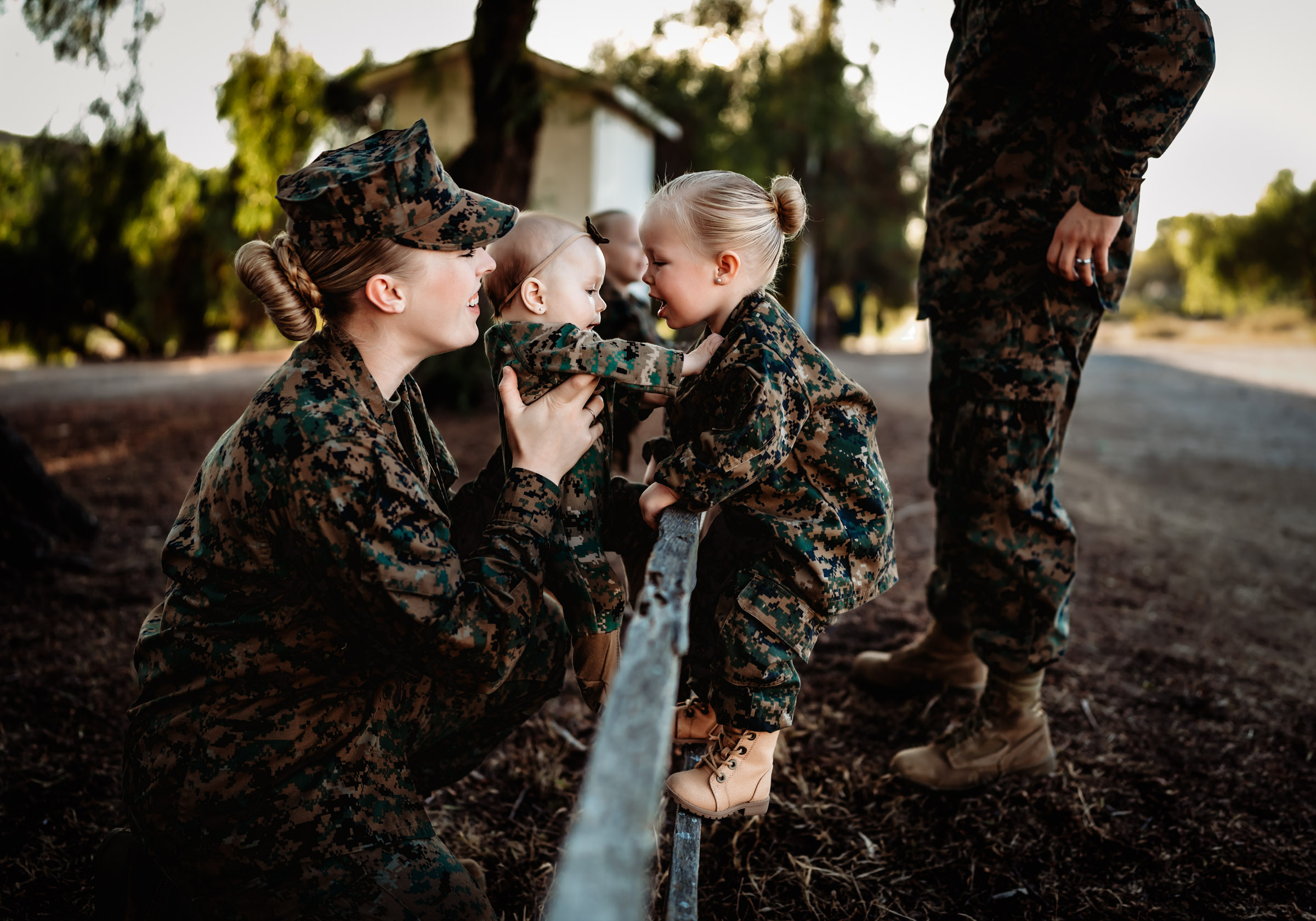Marine Corp mom playing with her little girls during a San Diego family photo session.