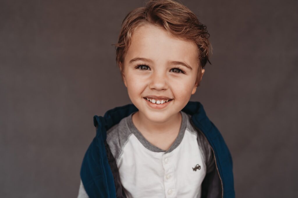 Little boy smiling during fine art school photography session | Love Michelle Photography