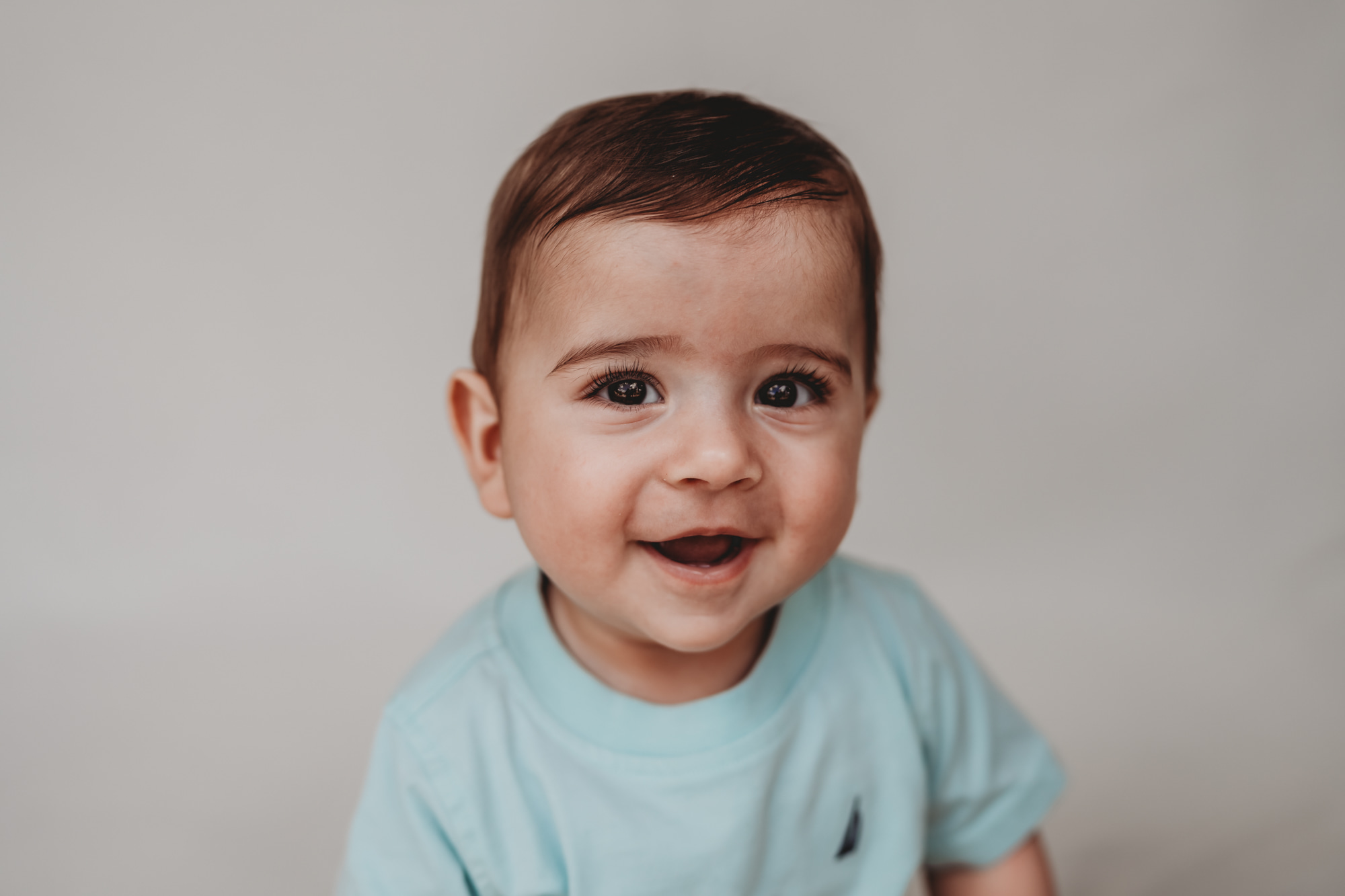 Little boy smiling during fine art school photos session | Love Michelle Photography