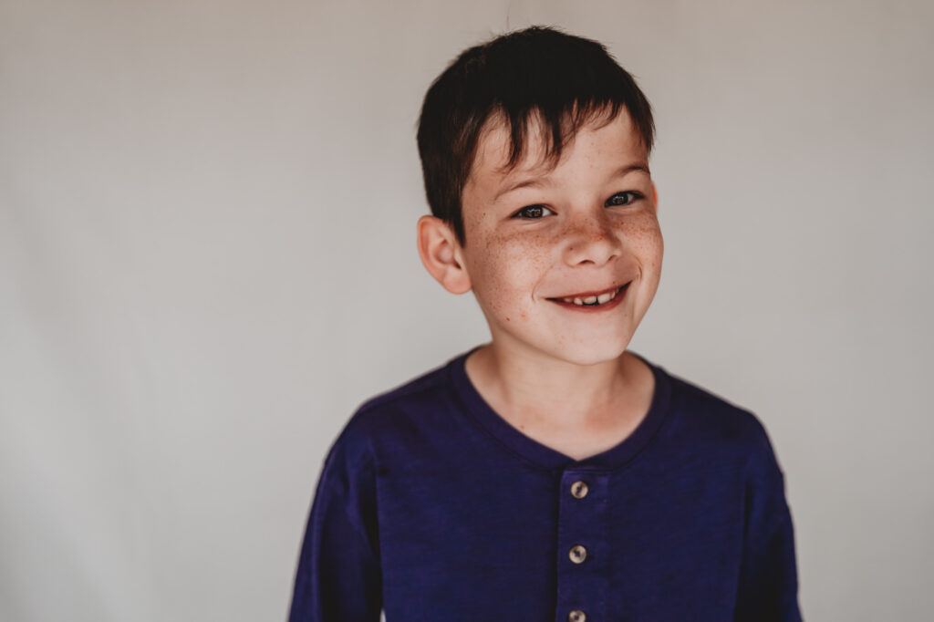 Little boy smiling during school photography session | Love Michelle Photography