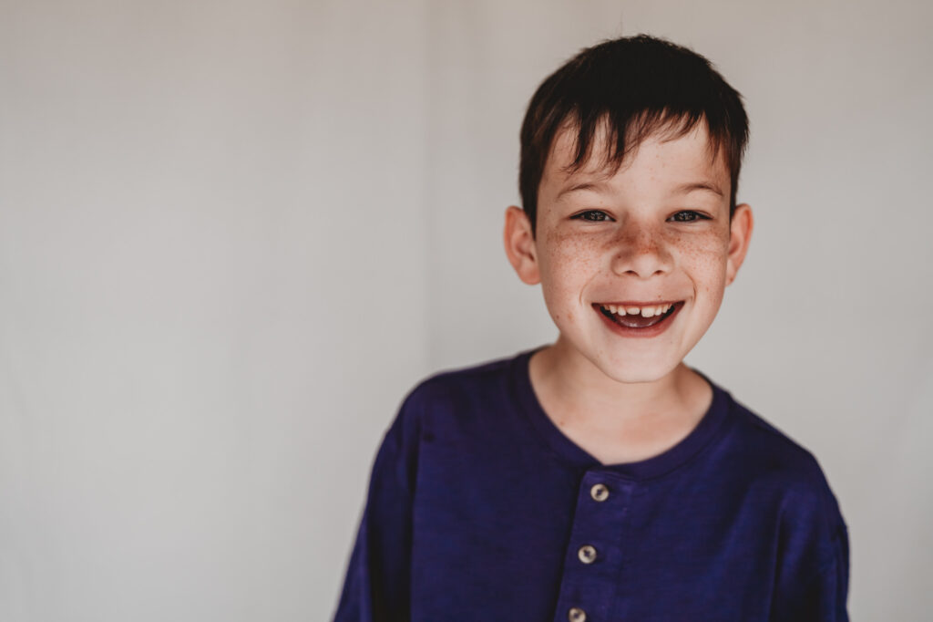 Little boy smiling during fine art school photos session | Love Michelle Photography 