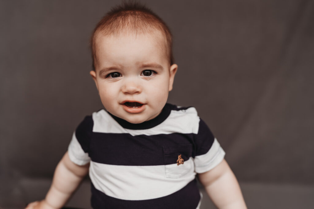 Little boy smiling during fine art school photos session | Love Michelle Photography