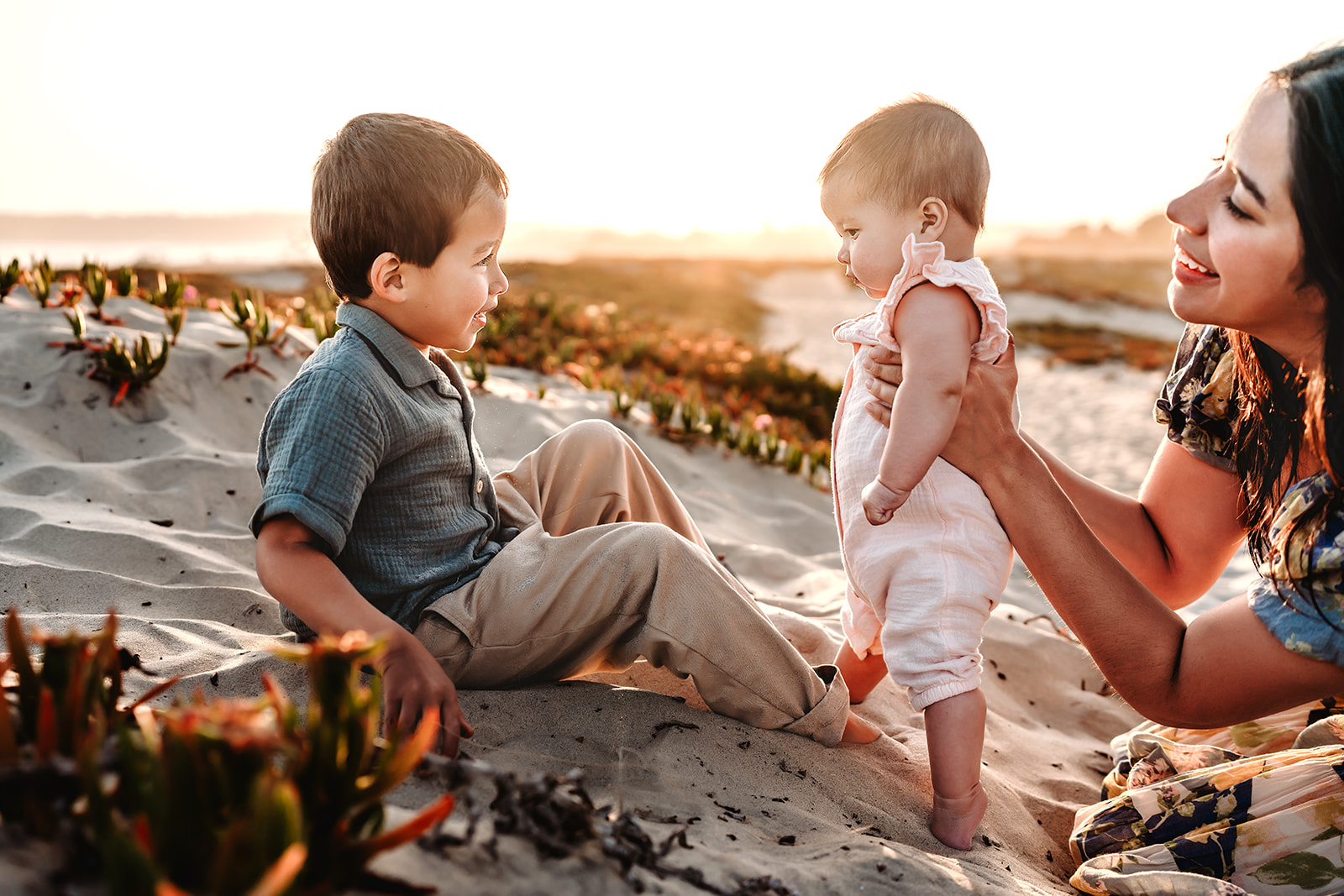 siblings photographed during family photo session during bedtime