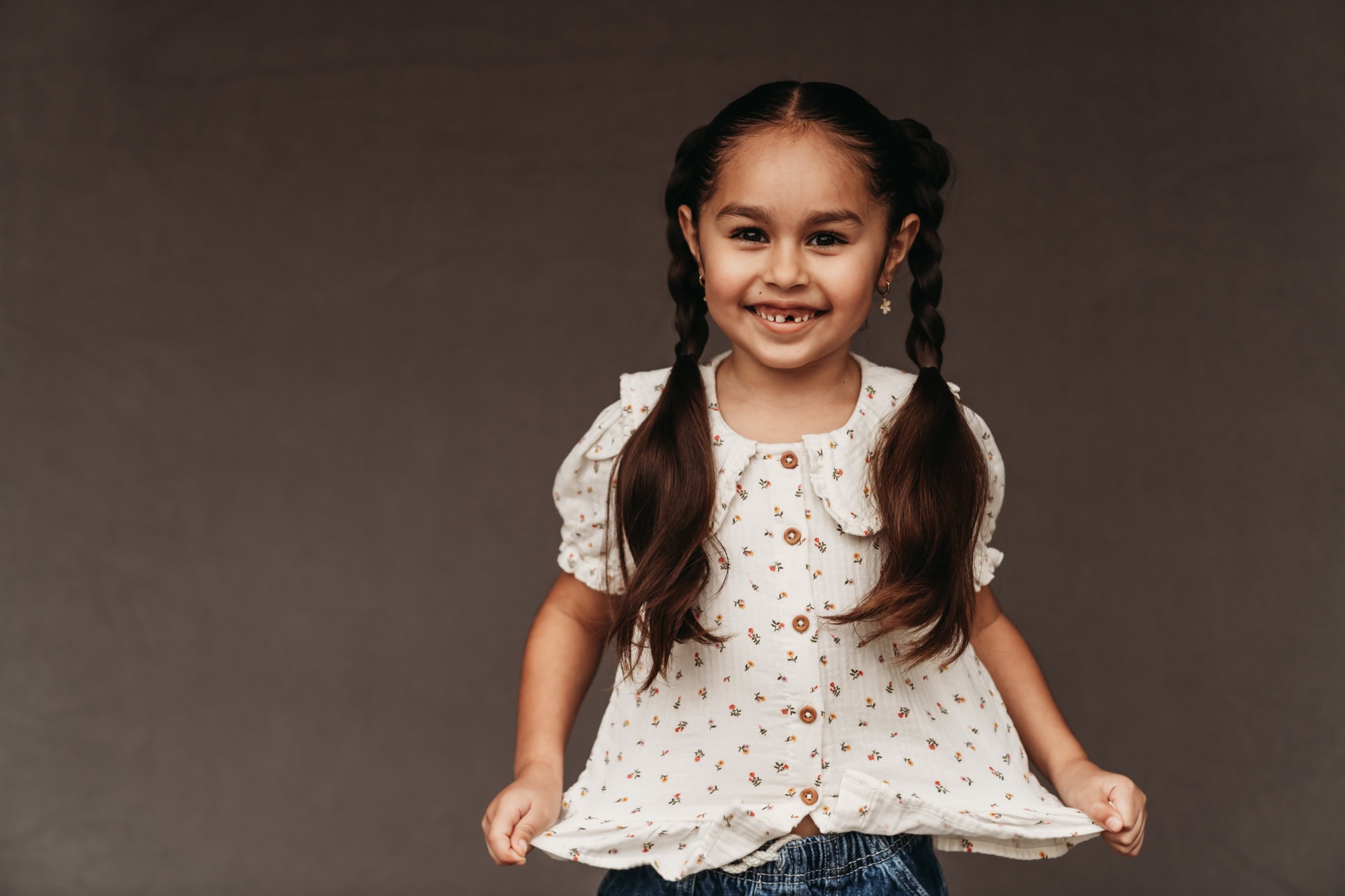 Fine art school portrait of smiling homeschool girl with braids, photographed by San Diego school photographer during homeschool photo day.