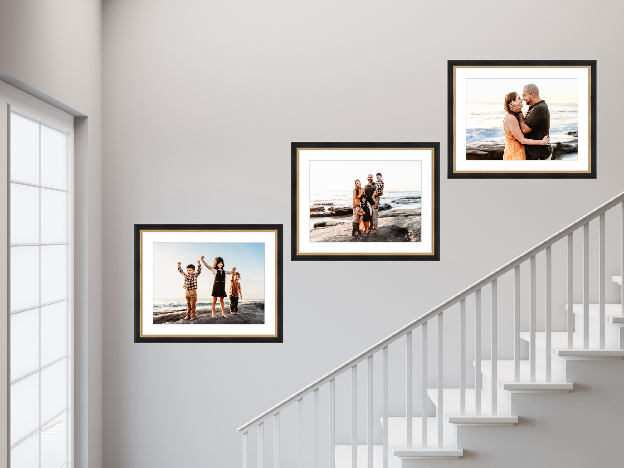 Framed family portraits displayed in a bright stairway of a San Diego home, photographed by Love Michelle Photography, showing how custom wall art turns a home into a daily reminder of family connection and love.