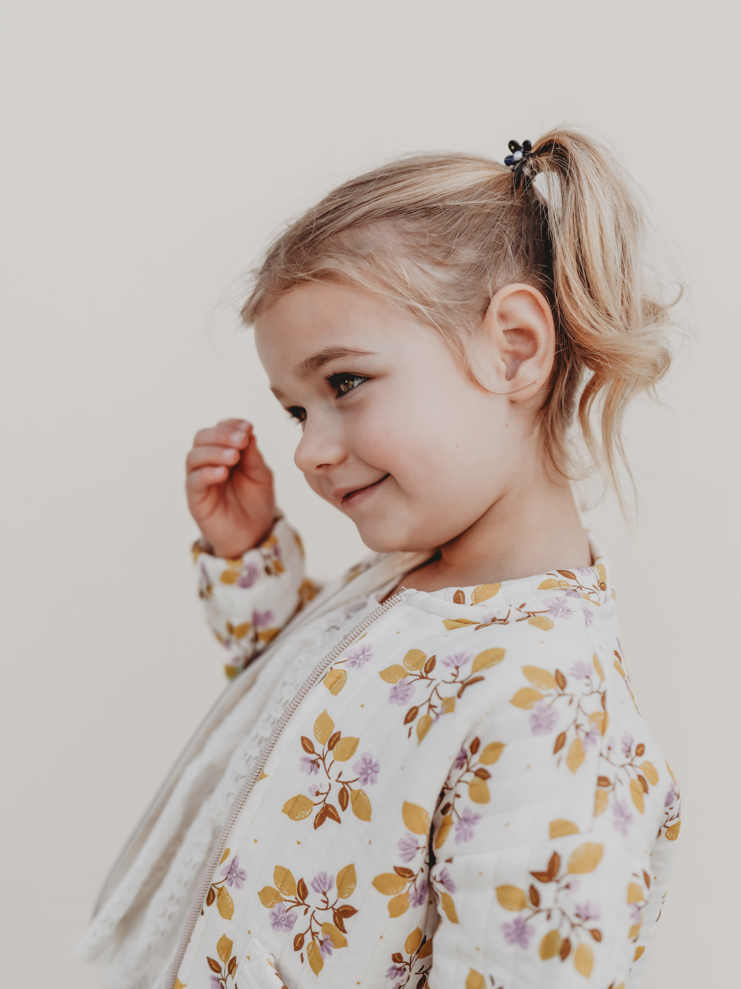 A San Diego Montessori student poses for her school photo by Love Michelle Photogrpaphy